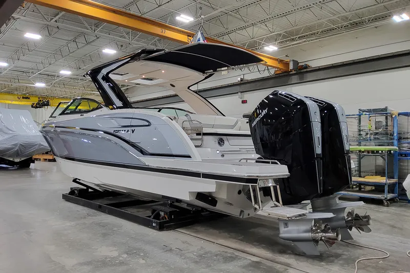 Slide: The Image of 2026 Formula 360 Crossover Bowrider OB in a showroom, featuring dual Mercury outboard engines. - 8