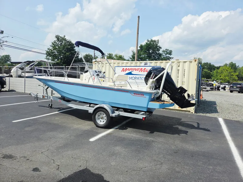 Slide: The Image of A blue 2027 Boston Whaler 170 Montauk on a trailer in a parking lot. - 3