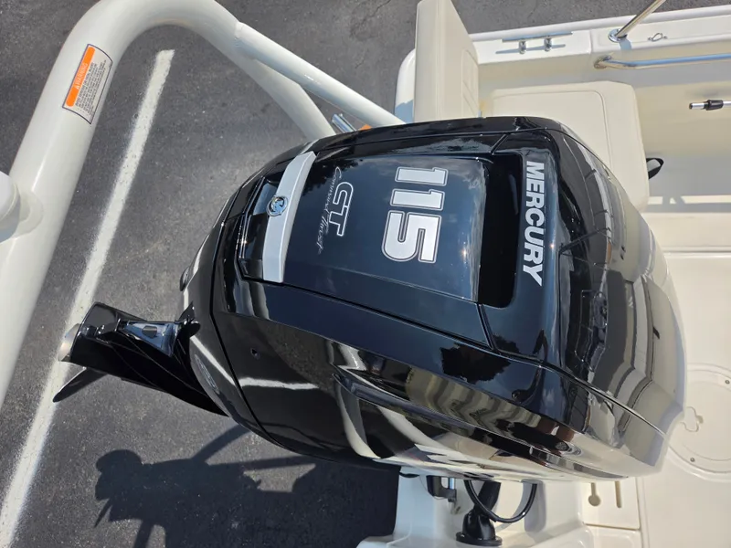 Slide: The Image of A Mercury 115 HP outboard motor is mounted on a Boston Whaler 170 Montauk boat. - 28