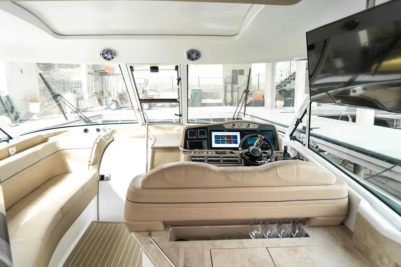 Slide: The Image of Interior of 2016 Formula 45 Yacht with modern helm and beige seating. - 10