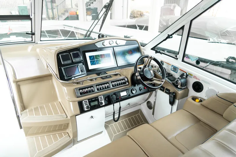 Slide: The Image of Helm of 2016 Formula 45 Yacht with advanced navigation controls and luxurious seating. - 12