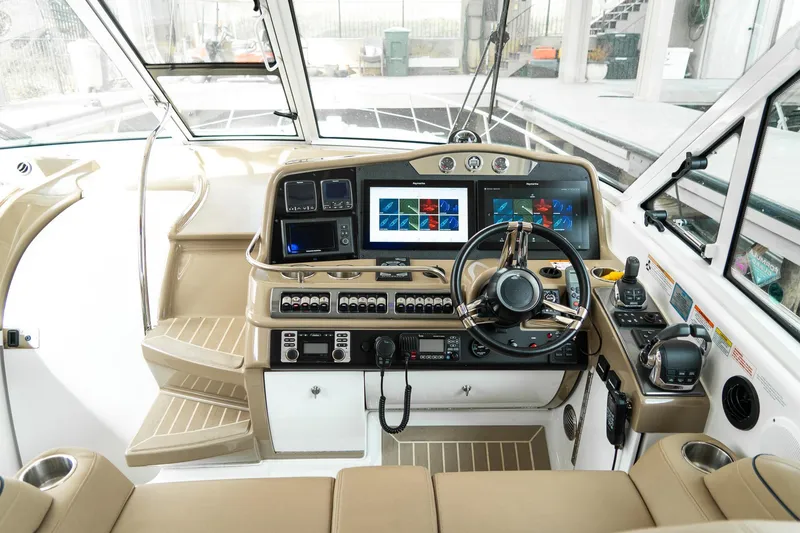 Slide: The Image of Interior cockpit of a 2016 Formula 45 Yacht with advanced navigation systems. - 13