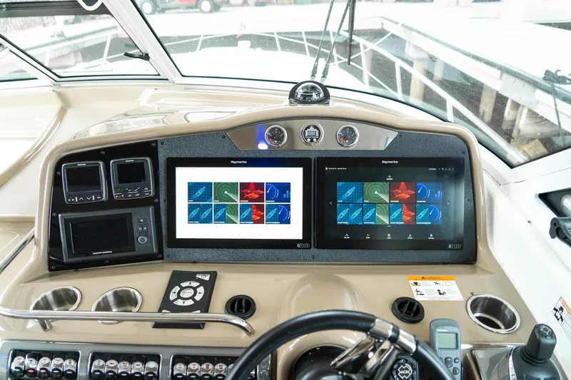 Slide: The Image of Helm of 2016 Formula 45 Yacht with dual Raymarine displays and navigation controls. - 15