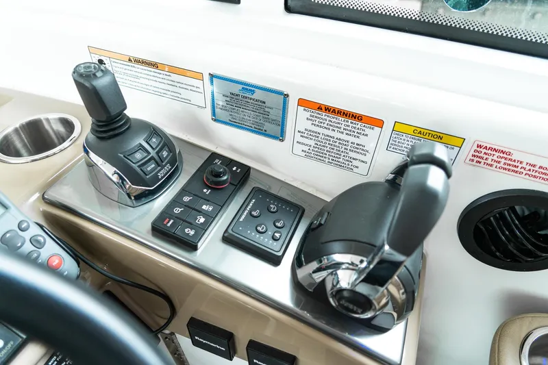 Slide: The Image of Control panel of a 2016 Formula 45 Yacht with joystick and throttle levers. - 17