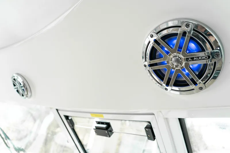 Slide: The Image of JL Audio speakers on 2016 Formula 45 Yacht, featuring sleek design and blue lighting. - 21