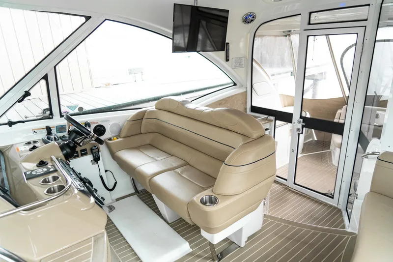 Slide: The Image of Interior of 2016 Formula 45 Yacht with beige seating and modern helm controls. - 25