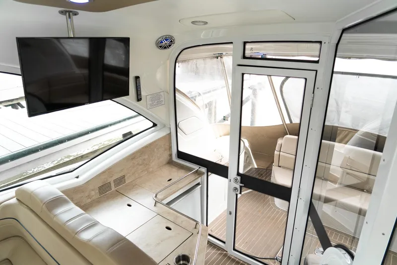 Slide: The Image of Interior of 2016 Formula 45 Yacht featuring modern seating, TV, and sleek design elements. - 28