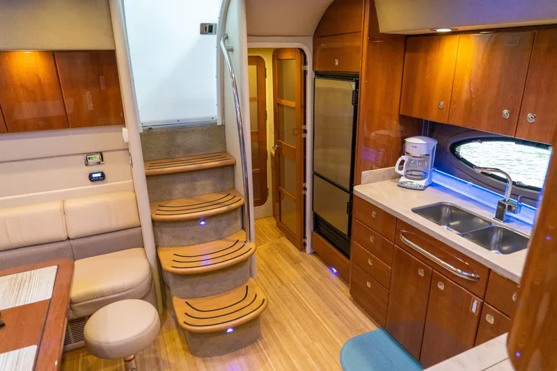 Slide: The Image of Luxurious interior of a 2016 Formula 45 Yacht featuring a modern kitchen and cozy seating area. - 44