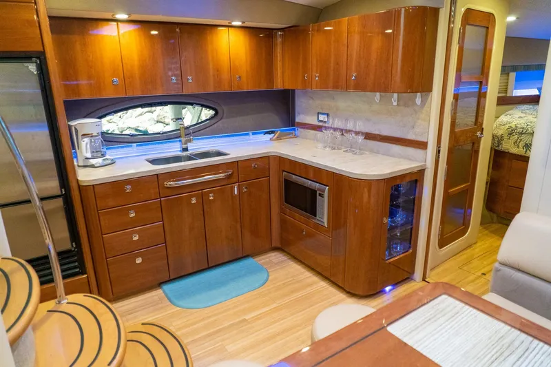 Slide: The Image of Luxurious kitchen interior of 2016 Formula 45 Yacht with wooden cabinetry and modern appliances. - 46