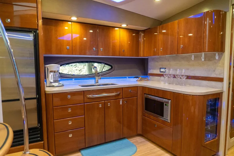 Slide: The Image of Luxurious kitchen interior of 2016 Formula 45 Yacht with wood cabinetry and modern appliances. - 47