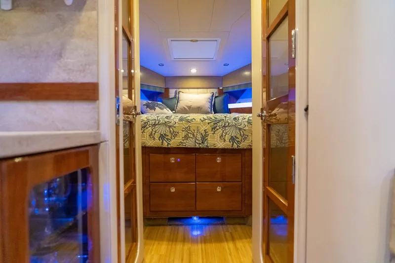 Slide: The Image of Interior of 2016 Formula 45 Yacht bedroom with elegant bedding and wooden cabinetry. - 50