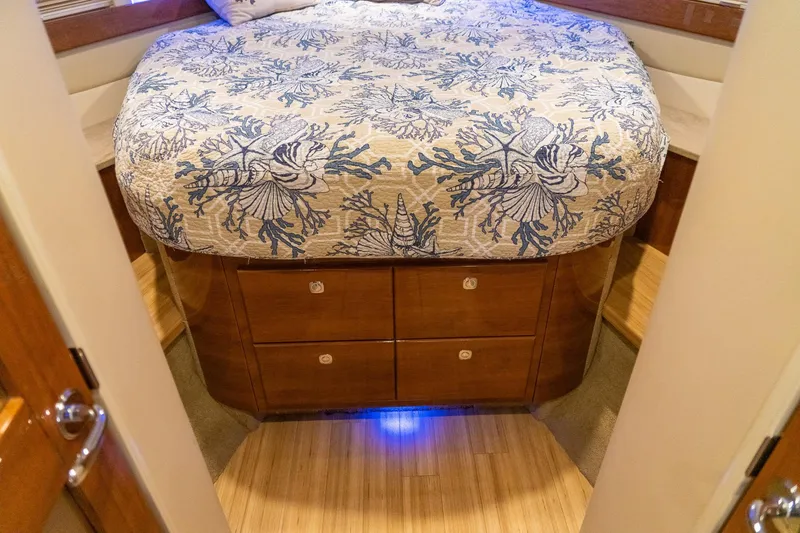 Slide: The Image of Cozy bedroom in 2016 Formula 45 Yacht with nautical-themed bedding and wooden cabinetry. - 53