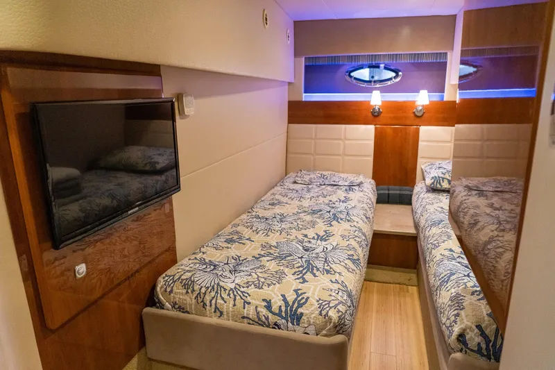 Slide: The Image of Luxurious twin cabin interior of 2016 Formula 45 Yacht with elegant bedding and modern amenities. - 59