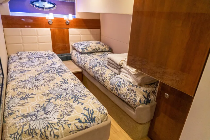 Slide: The Image of Luxurious twin cabin interior of 2016 Formula 45 Yacht with nautical-themed bedding. - 60