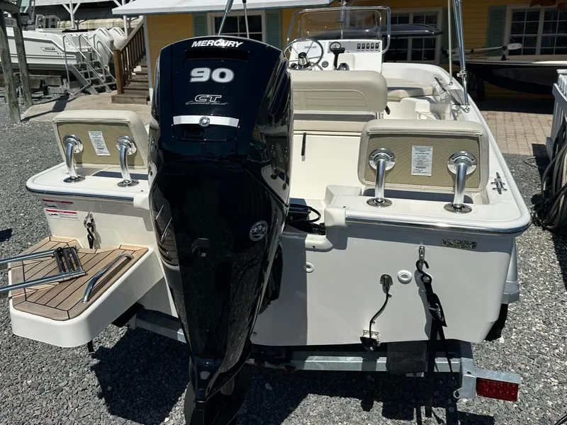 Slide: The Image of The image shows a 2027 Boston Whaler 170 Montauk boat with a Mercury 90 HP outboard motor. - 4