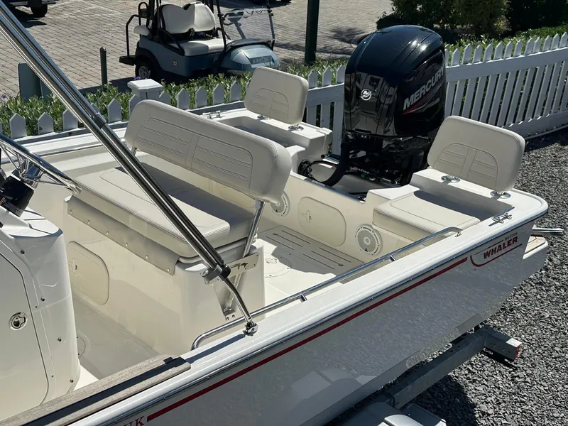 Slide: The Image of The image shows a 2027 Boston Whaler 170 Montauk boat with a Mercury outboard motor. - 15