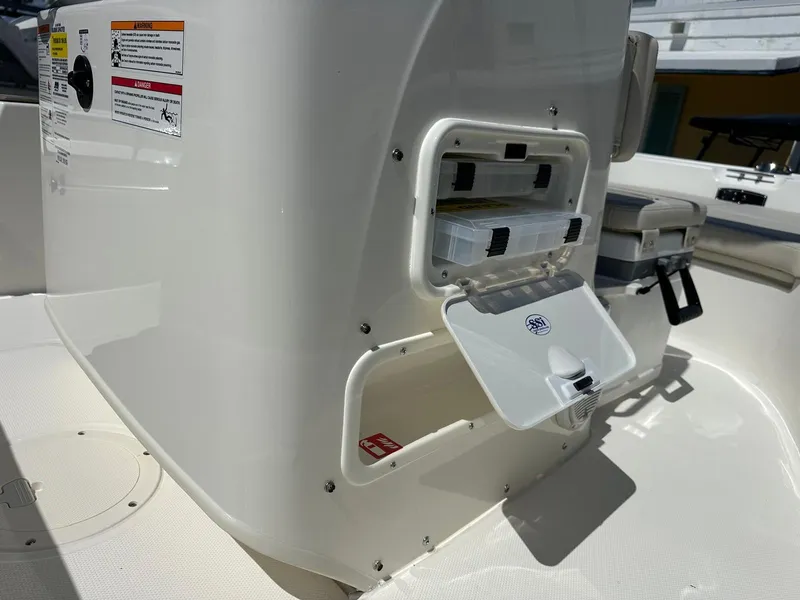 Slide: The Image of The image shows the storage compartment of a 2027 Boston Whaler 170 Montauk boat. - 12