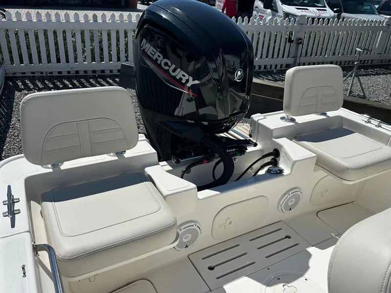 Slide: The Image of The image shows the interior of a Boston Whaler 170 Montauk with a Mercury outboard motor. - 16