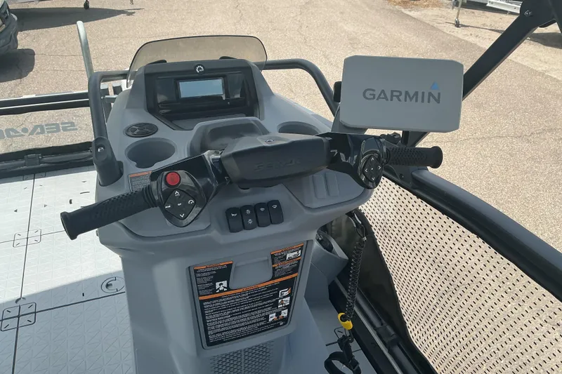 Slide: The Image of 2023 Sea-Doo Switch Sport Compact dashboard with Garmin navigation system and control panel. - 13