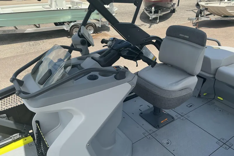 Slide: The Image of 2023 Sea-Doo Switch Sport Compact interior with steering console and seating. - 14