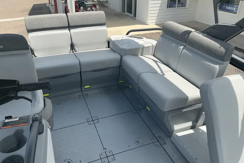 Slide: The Image of 2023 Sea-Doo Switch Sport Compact interior with gray seating and spacious layout. - 15