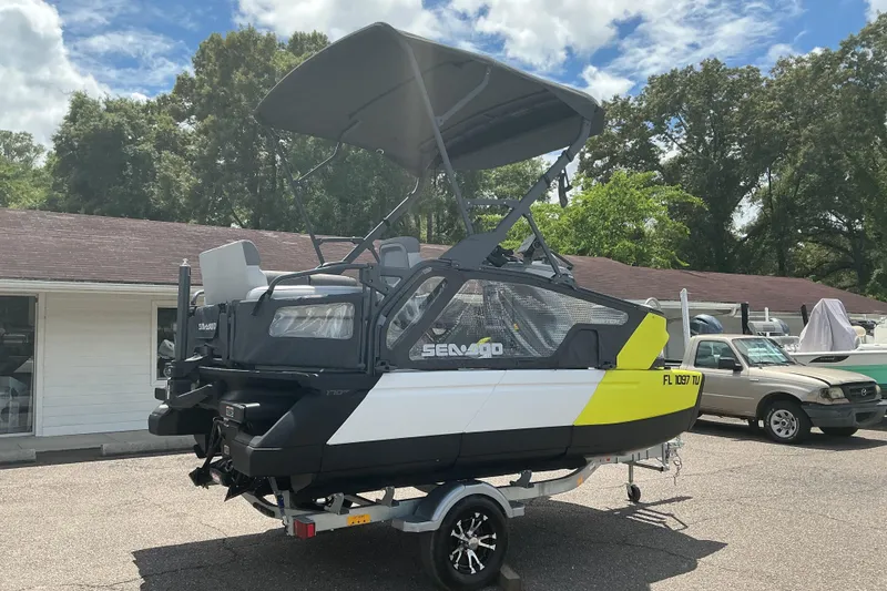 Slide: The Image of 2023 Sea-Doo Switch Sport Compact on trailer, parked outdoors under a clear sky. - 16