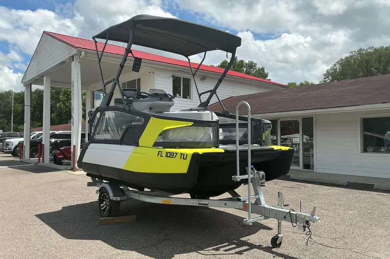 Slide: The Image of 2023 Sea-Doo Switch Sport Compact on trailer, parked outside dealership. - 18