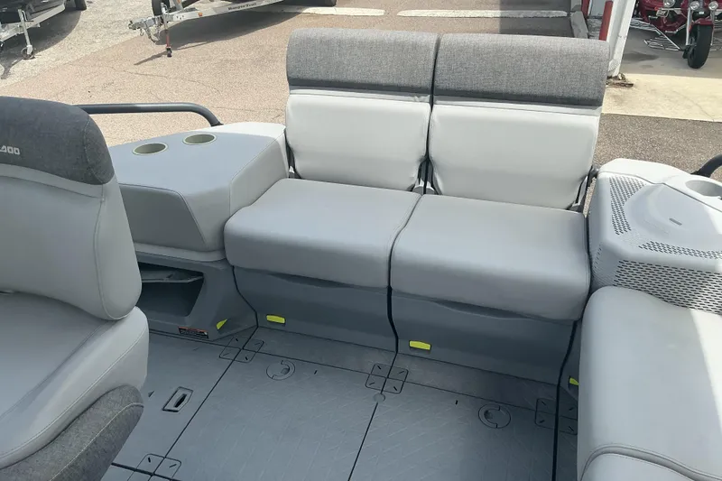 Slide: The Image of 2023 Sea-Doo Switch Sport Compact interior with gray seating and cup holders. - 9