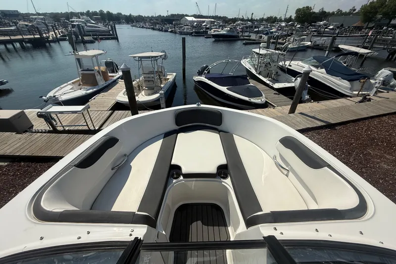 Slide: The Image of 2019 Bayliner VR5 Bowrider OB docked at a marina with other boats. - 7