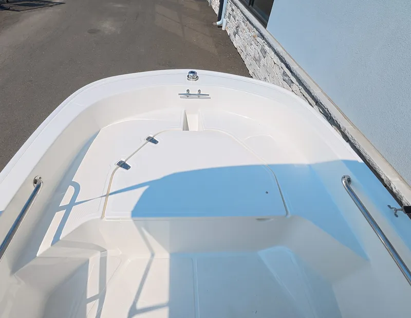 Slide: The Image of The image shows the bow deck of a 2027 Boston Whaler 130 Super Sport. - 11