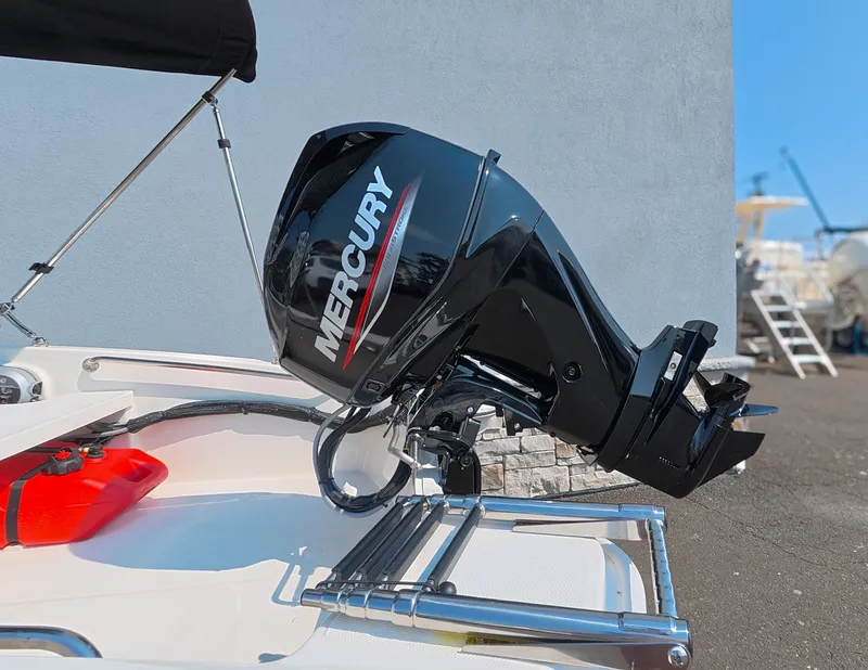 Slide: The Image of A Mercury outboard motor is mounted on a 2027 Boston Whaler 130 Super Sport. - 5