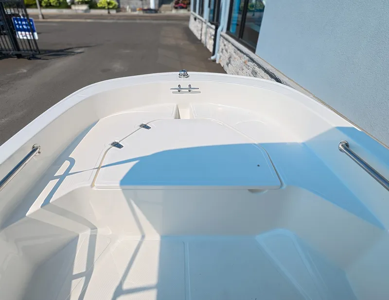 Slide: The Image of The image shows the bow area of a 2027 Boston Whaler 130 Super Sport. - 12
