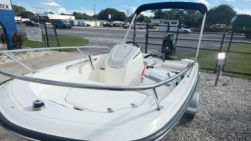 Slide: The Image of The image shows a 2027 Boston Whaler 130 Super Sport boat with an open deck and outboard motor. - 5