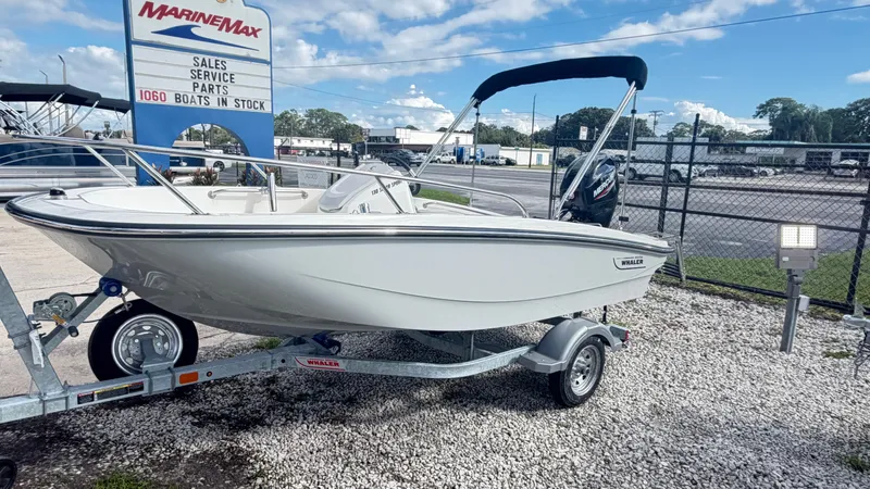 Slide: The Image of A 2027 Boston Whaler 130 Super Sport on a trailer in an outdoor setting. - 3