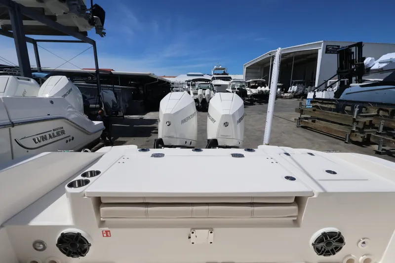 Slide: The Image of The image shows the stern of a Boston Whaler 280 Dauntless with two Mercury outboard engines. - 5