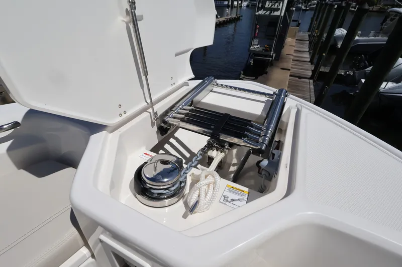 Slide: The Image of The 2027 Boston Whaler 280 Dauntless features an anchor windlass and ladder in the bow area. - 22