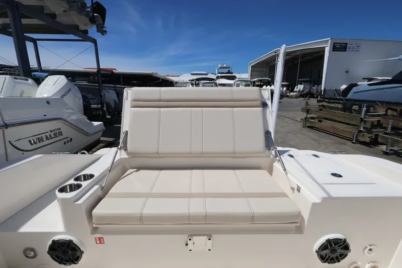 Slide: The Image of The 2027 Boston Whaler 280 Dauntless features a spacious, cushioned outdoor bench seat. - 6