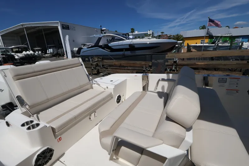 Slide: The Image of The image shows the cockpit of a Boston Whaler 280 Dauntless with beige seating and speakers. - 7