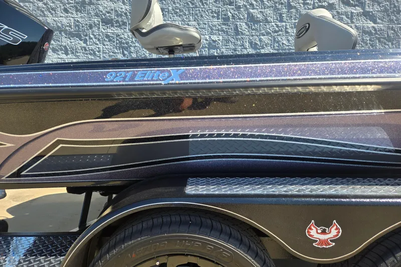 Slide: The Image of 2026 Phoenix 921 Elite X boat with sleek design and logo detail. - 3