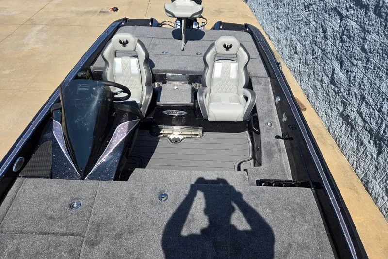 Slide: The Image of 2026 Phoenix 921 Elite X boat interior with gray seating and sleek dashboard design. - 8