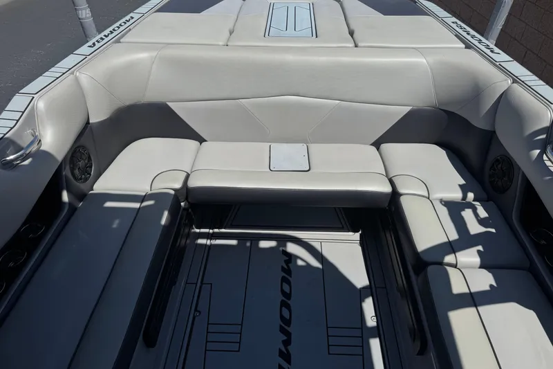 Slide: The Image of 2022 Moomba Max boat interior with gray seating and speaker system. - 17