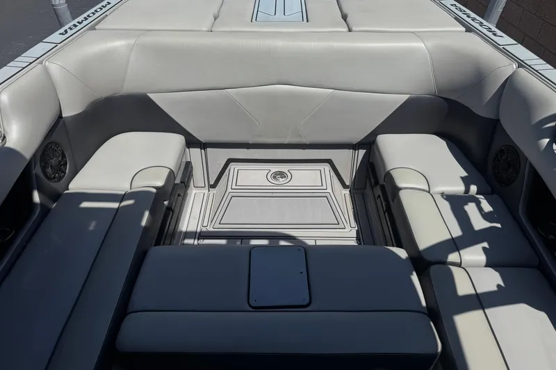 Slide: The Image of 2022 Moomba Max boat interior with gray seating and speaker system. - 18