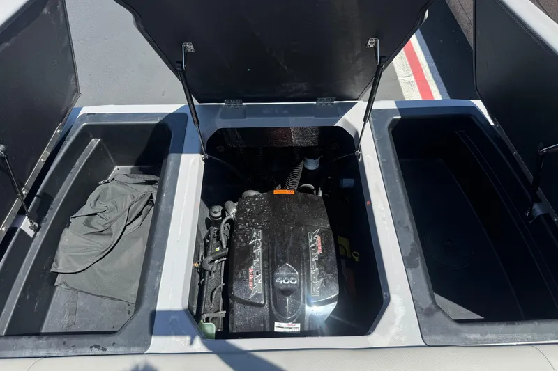 Slide: The Image of 2022 Moomba Max engine compartment with Raptor motor, open storage compartments. - 20