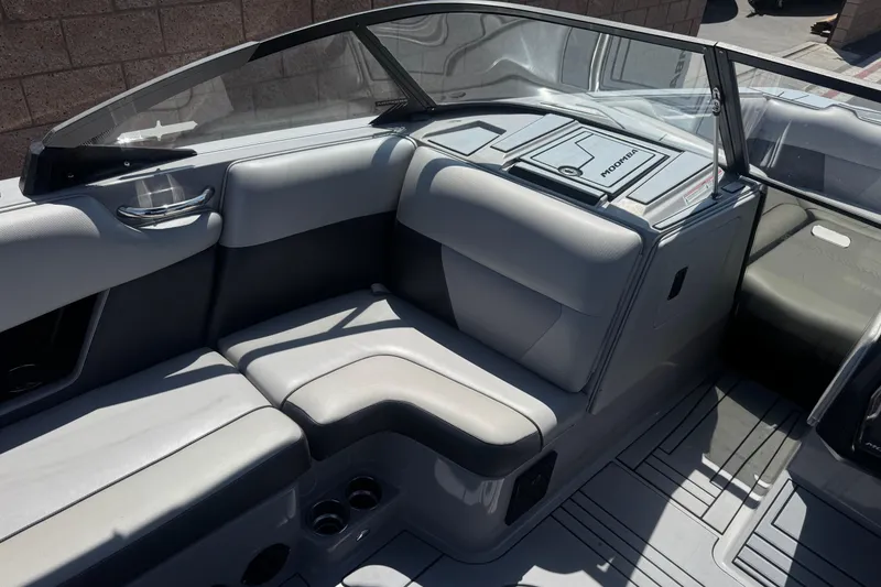 Slide: The Image of 2022 Moomba Max boat interior with gray seating and sleek design. - 22