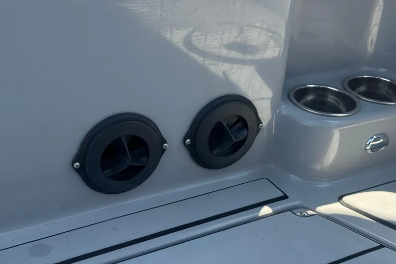 Slide: The Image of 2022 Moomba Max boat interior with cup holders and ventilation outlets. - 25