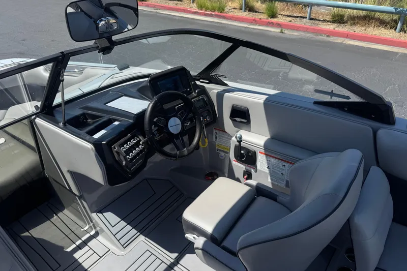Slide: The Image of 2022 Moomba Max boat interior with modern dashboard and steering wheel. - 26