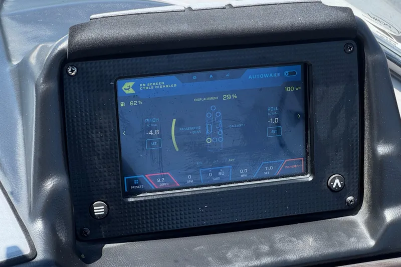 Slide: The Image of 2022 Moomba Max boat dashboard display showing Autowake settings and controls. - 29