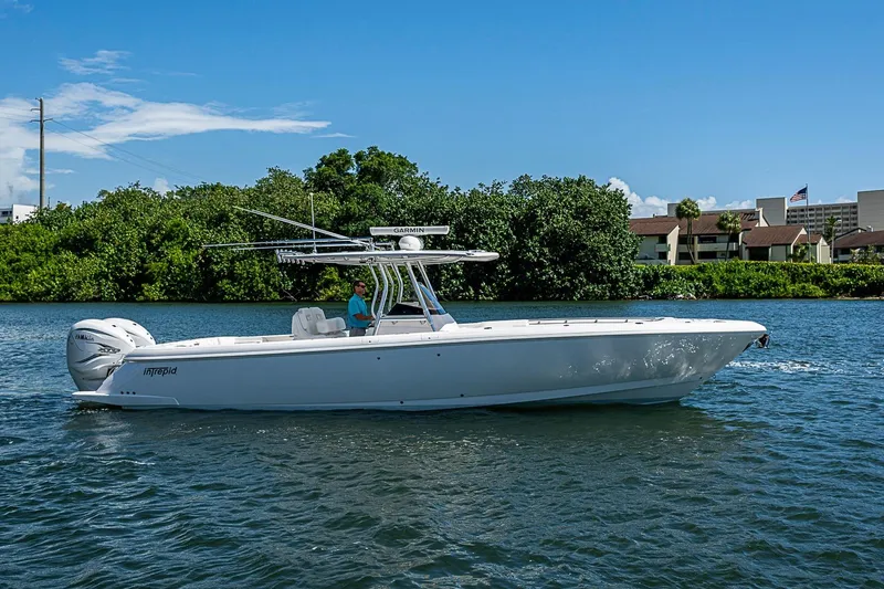 Slide: The Image of 2020 Intrepid 345 Nomad FE boat cruising on a sunny day. - 1