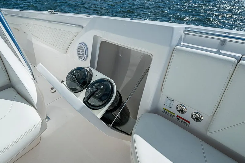 Slide: The Image of Interior of 2020 Intrepid 345 Nomad FE boat with storage compartment and seating. - 32