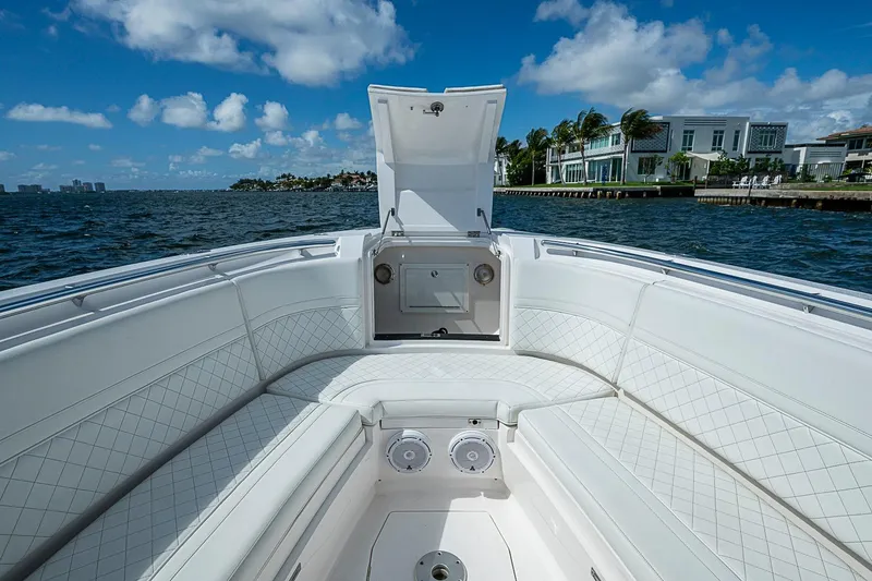 Slide: The Image of 2020 Intrepid 345 Nomad FE boat interior with luxurious seating and ocean view. - 33